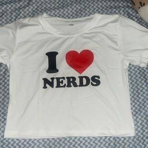 i heart nerds white baby tee new. wrong sizei just got it today in the mail.